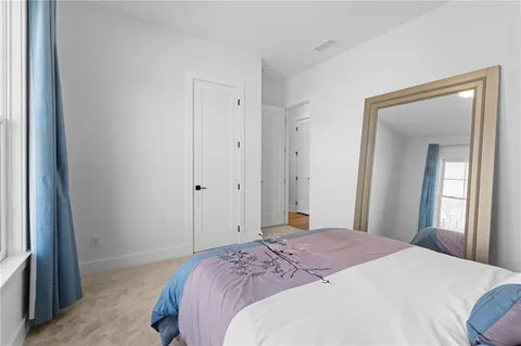a view of a big room with closet and wooden floor