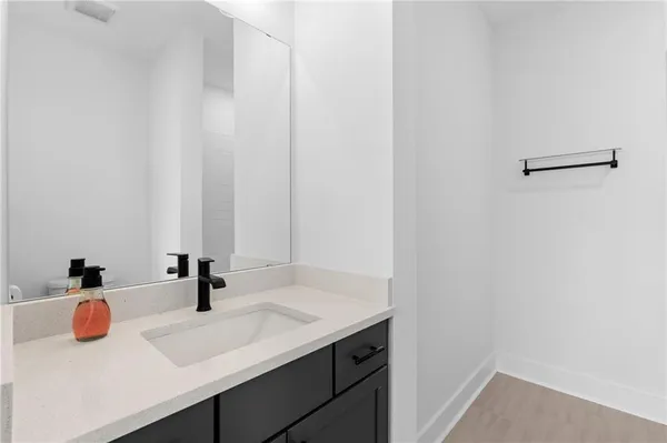 a view of a livingroom with furniture and floor to ceiling window