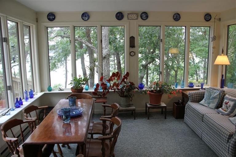 62 Turning Mill Road Brewster, MA 02631 - Photo 11 of 27 a view of a dining room with furniture and a large window