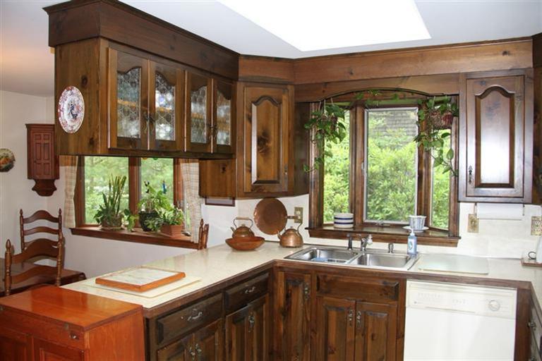 62 Turning Mill Road Brewster, MA 02631 - Photo 13 of 27 a kitchen with a sink and large window