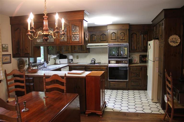 62 Turning Mill Road Brewster, MA 02631 - Photo 14 of 27 a kitchen with kitchen island a counter top space a sink and appliances