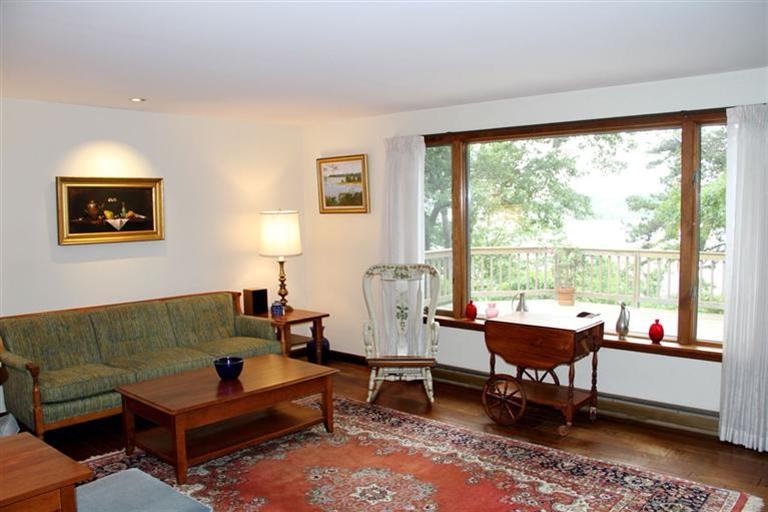 62 Turning Mill Road Brewster, MA 02631 - Photo 16 of 27 a living room with furniture and a large window