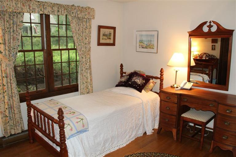 62 Turning Mill Road Brewster, MA 02631 - Photo 18 of 27 a bedroom with a bed and a window