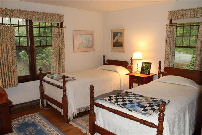 62 Turning Mill Road Brewster, MA 02631 - Photo 21 of 27 a bedroom with a bed and a window