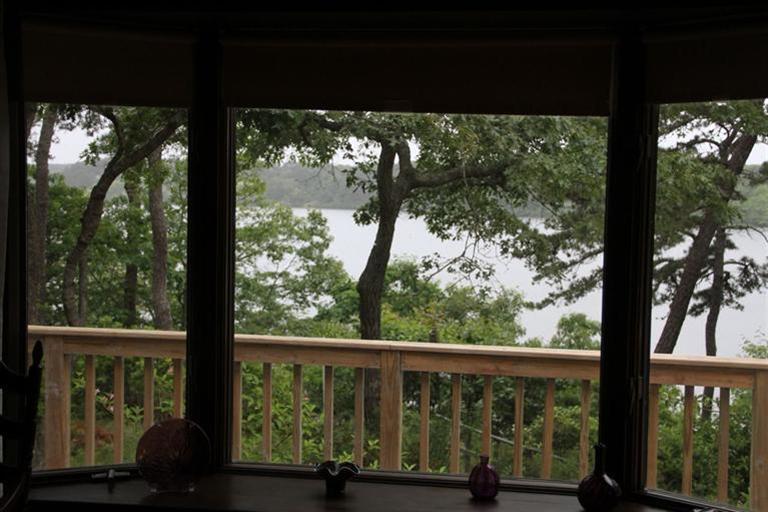 62 Turning Mill Road Brewster, MA 02631 - Photo 26 of 27 a view of a porch with a yard