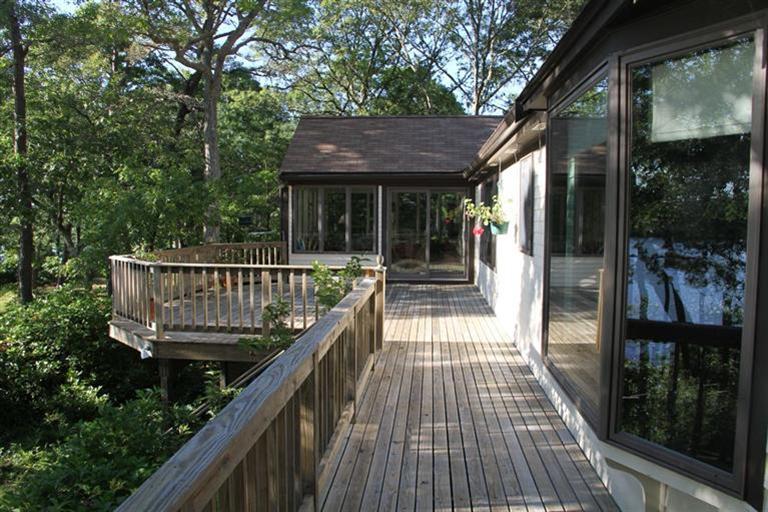 62 Turning Mill Road Brewster, MA 02631 - Photo 4 of 27 a view of balcony with wooden floor and outdoor seating