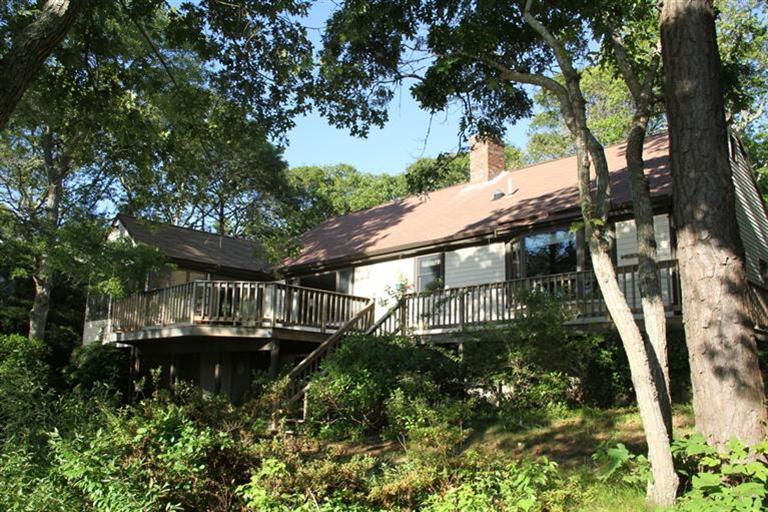 62 Turning Mill Road Brewster, MA 02631 - Photo 7 of 27 a view of swimming pool from a lake view