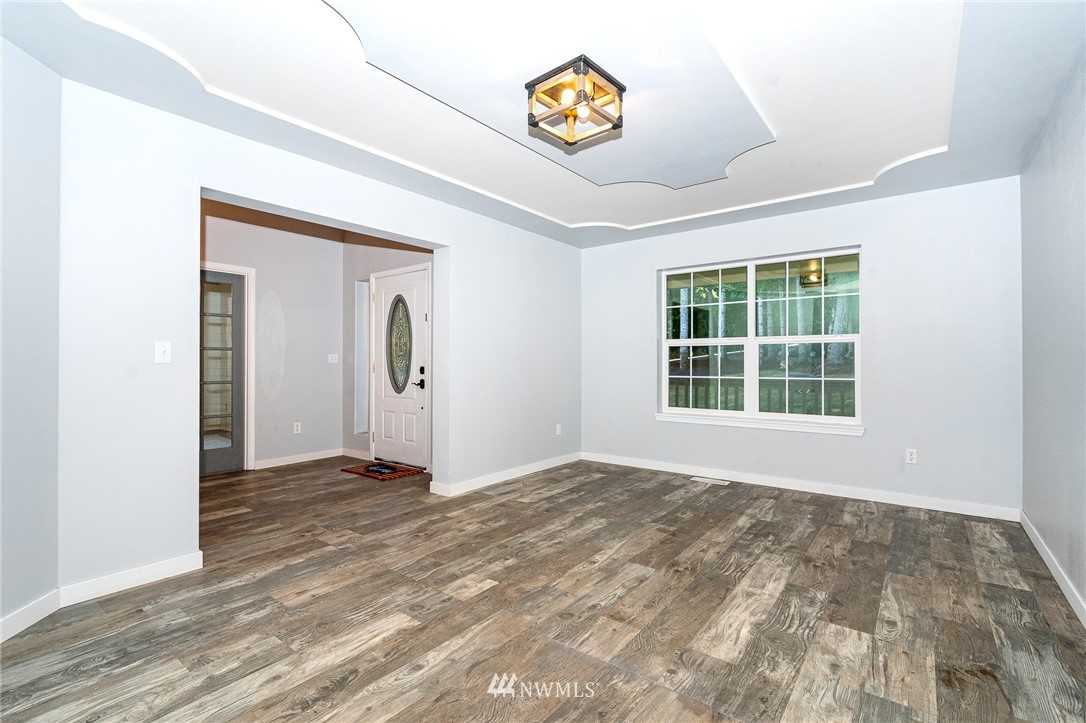 222 Crego Ridge Road Chehalis, WA 98532 - Photo 22 of 40 a view of an empty room with wooden floor and a window