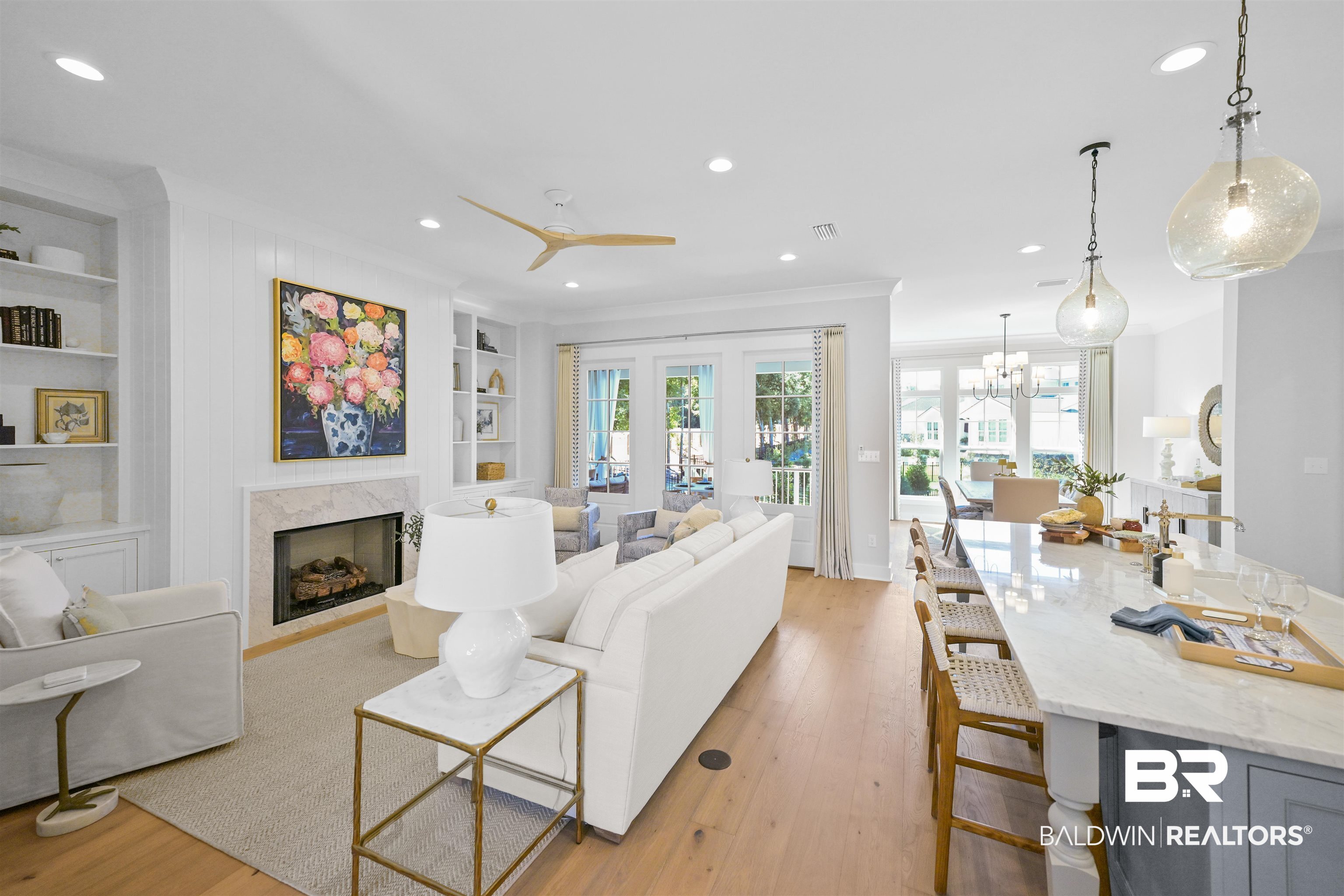 156 Hyacinth Street Fairhope, AL 36532 - Photo 10 of 61 Living room featuring recessed lighting, built in shelves, light wood-type flooring, a fireplace, and a ceiling fan