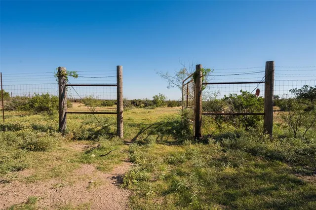 a view of a ocean with a building in the background