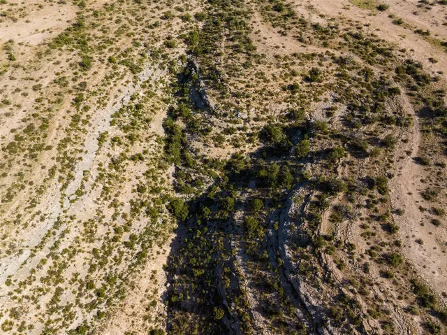 an aerial view of residential building and ocean