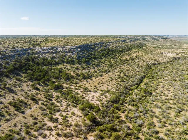 an aerial view of residential building and ocean