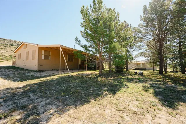 a view of a backyard of a house