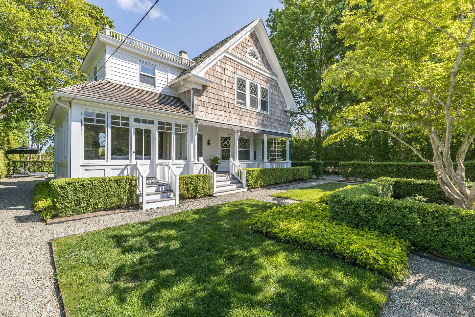a view of a house with backyard sitting area and garden