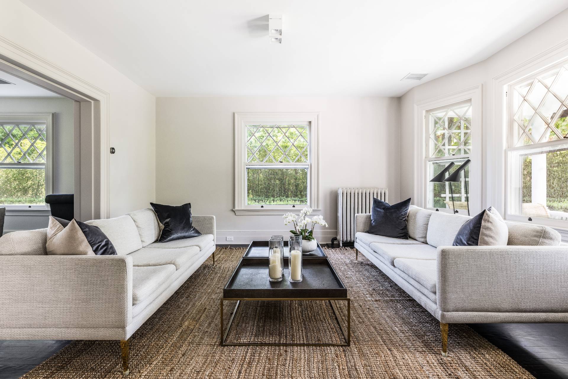 196 Maple Lane Bridgehampton, NY 11932 - Photo 13 of 25 a living room with furniture and a large window