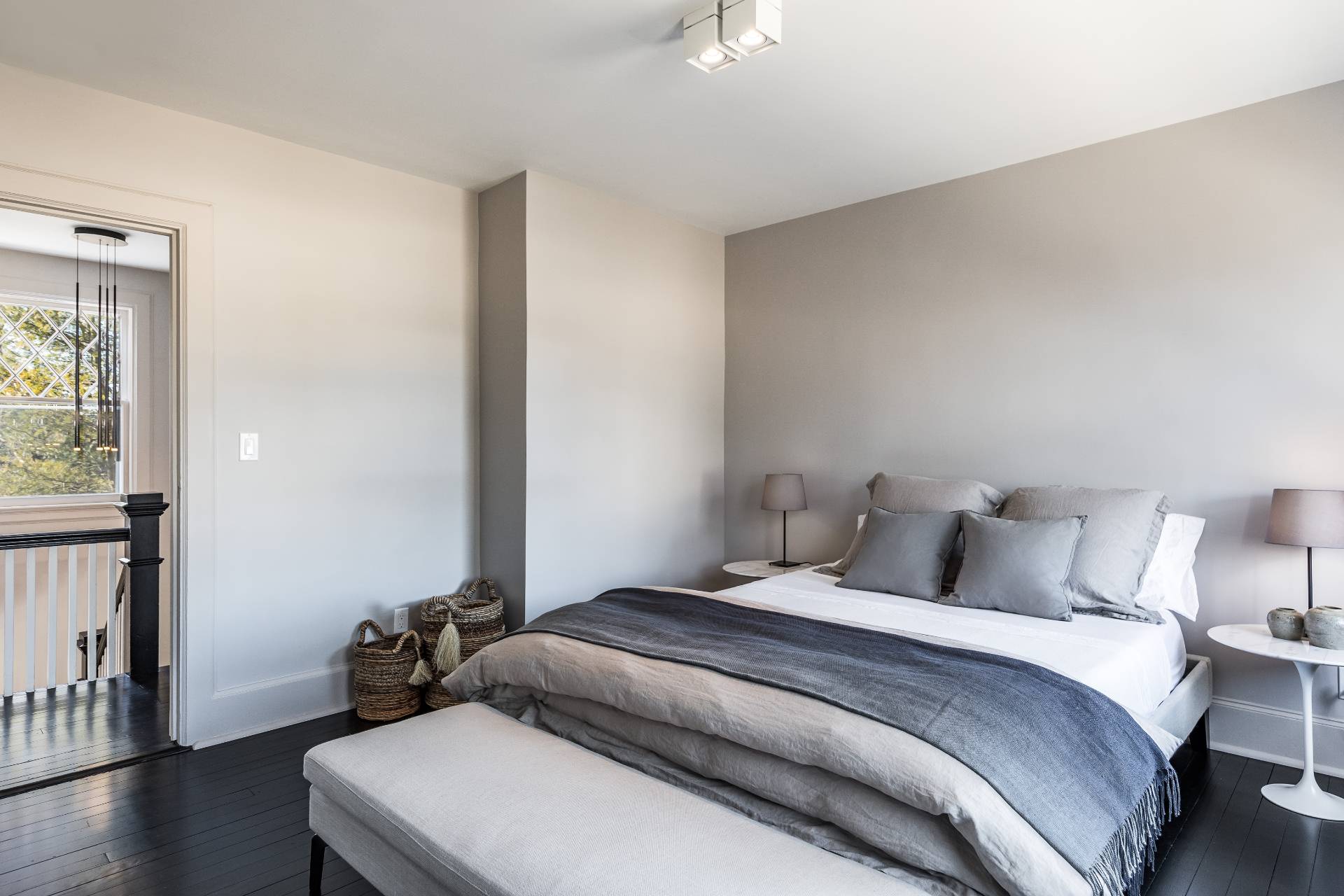 196 Maple Lane Bridgehampton, NY 11932 - Photo 22 of 25 a bedroom with a bed and a large window