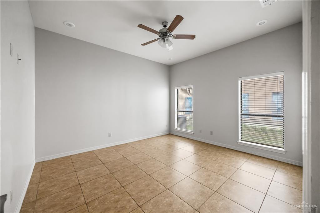 2715 Mimosa Street, Unit 2 Mission, TX 78574 - Photo 10 of 13 a view of a livingroom with a ceiling fan and window