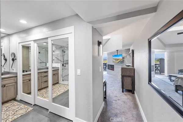 a view of a hallway view with living room and with furniture