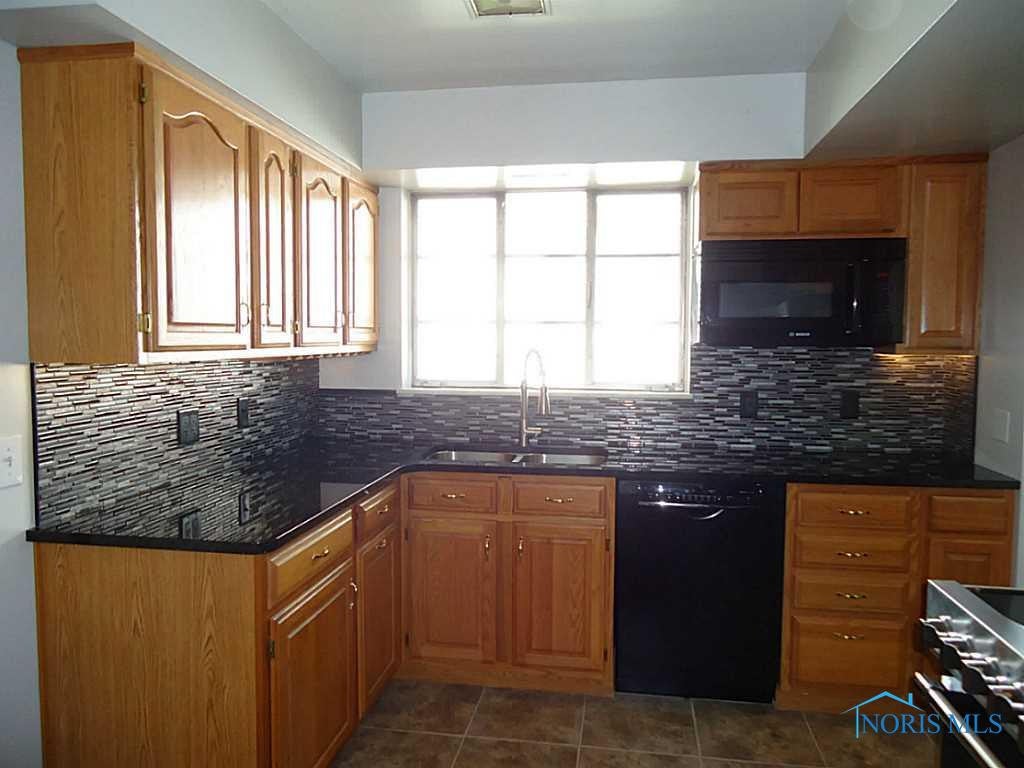 2416 Hempstead Road Toledo, OH 43606 - Photo 8 of 19 Kitchen. stone counter tops & new cabinets