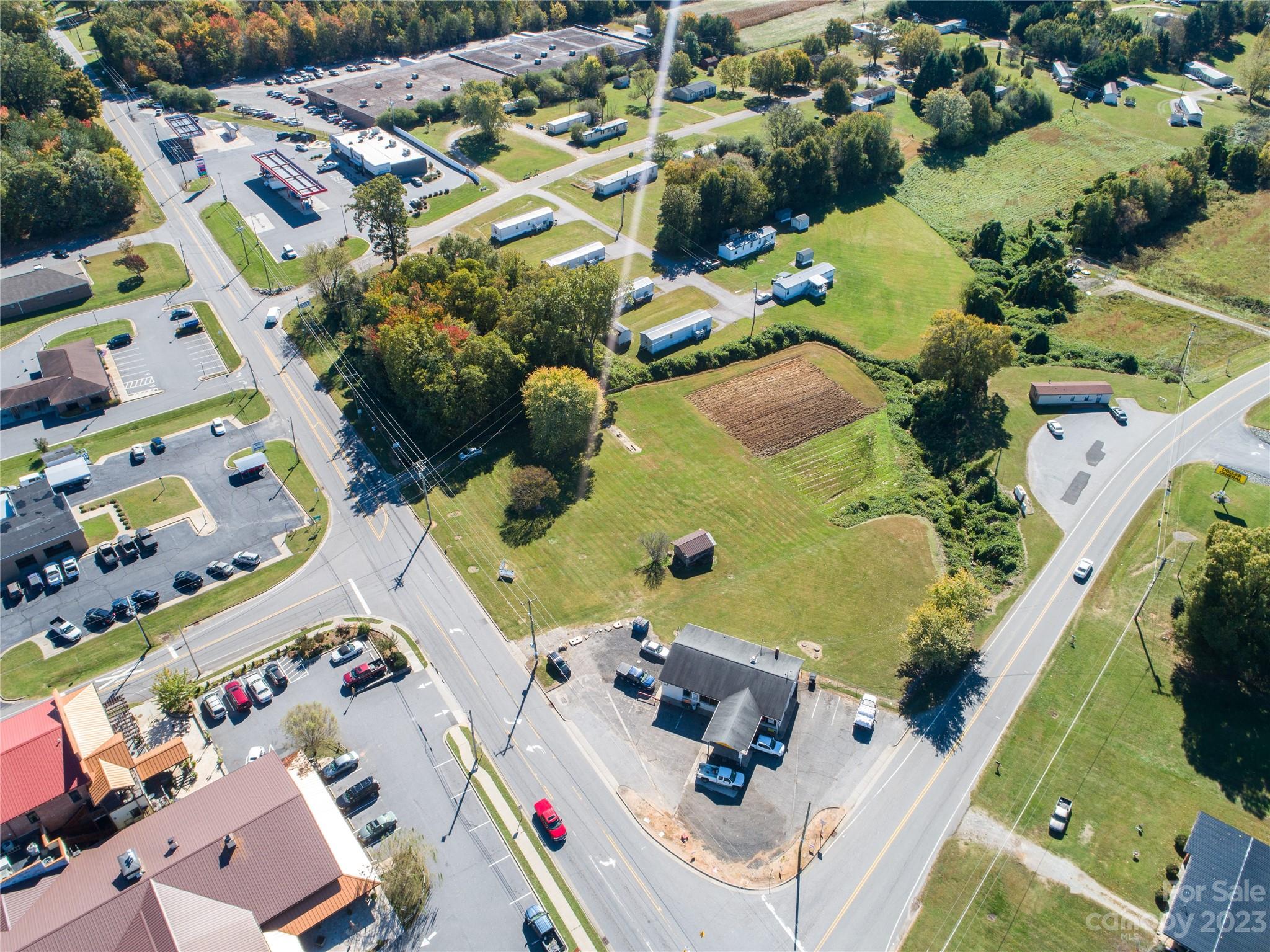 5090 Highway 90 Hiddenite, NC 28636 - Photo 11 of 17 an aerial view of a house with a swimming pool