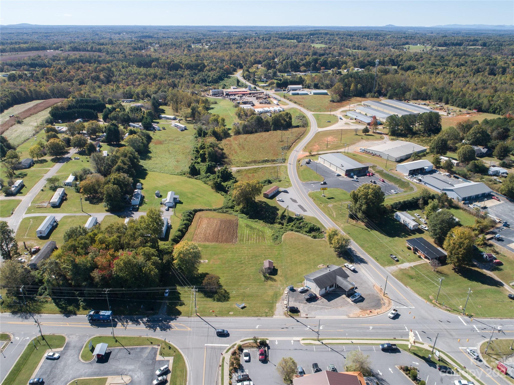 5090 Highway 90 Hiddenite, NC 28636 - Photo 12 of 17 an aerial view of residential houses with outdoor space