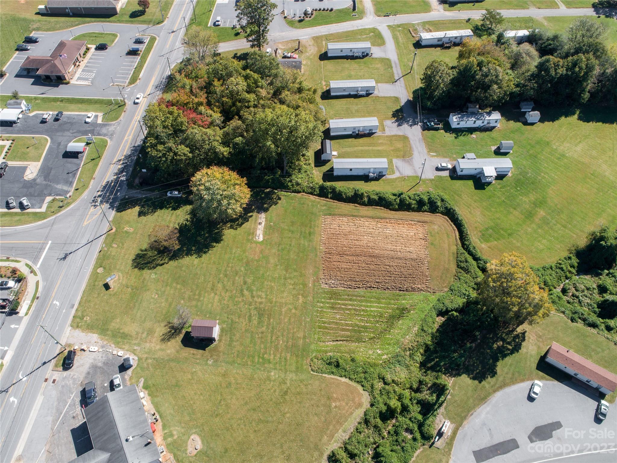 5090 Highway 90 Hiddenite, NC 28636 - Photo 9 of 17 an aerial view of a house with a yard and pool