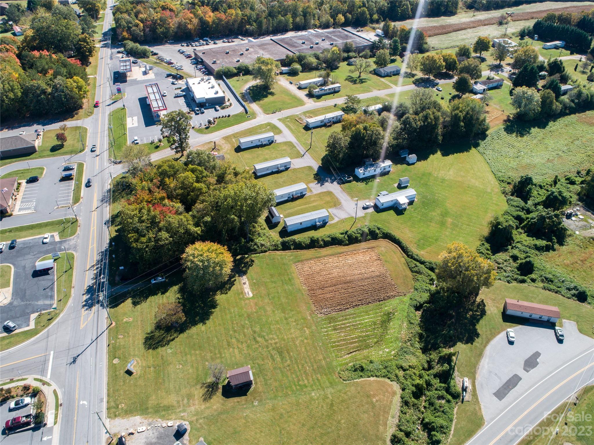 5090 Highway 90 Hiddenite, NC 28636 - Photo 10 of 17 an aerial view of residential houses with outdoor space