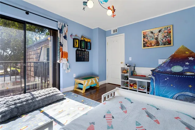 a bed room with a bed and a window