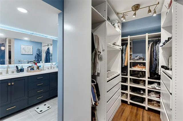 a kitchen with a refrigerator and a sink