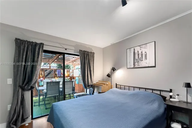 a bedroom with a large bed and a large window