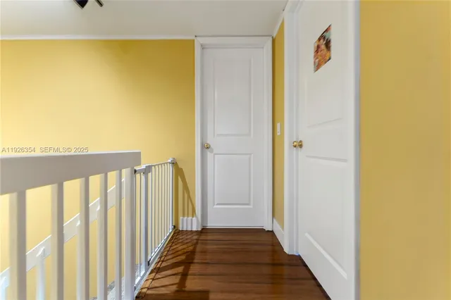 a view of a bathroom with wooden floor