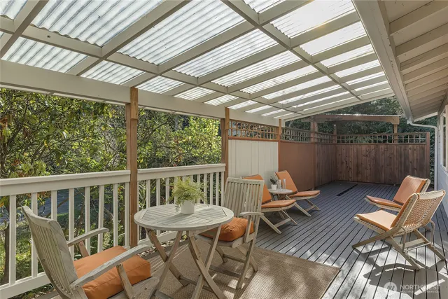 a view of a chair and table in the balcony