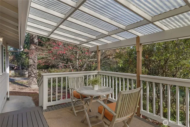 a view of a chair and table in the balcony