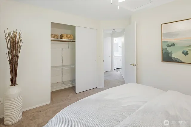 a bedroom with a bed and a view of bathroom