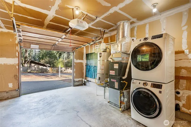 a view of a hallway with washer and dryer