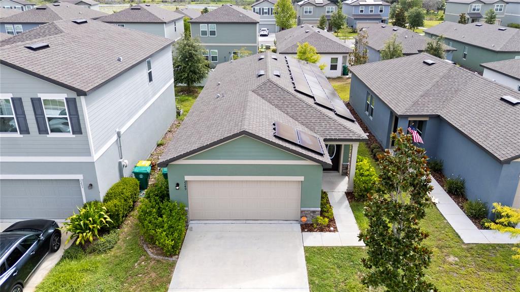2249 Litchfield Loop DeLand, FL 32720 - Photo 2 of 27 an aerial view of a house with swimming pool garden and patio