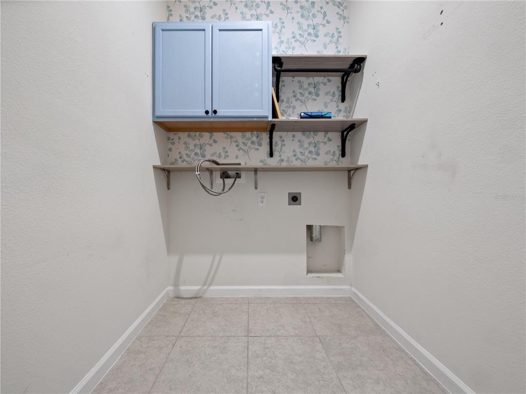 2249 Litchfield Loop DeLand, FL 32720 - Photo 23 of 27 a view of kitchen with cabinets