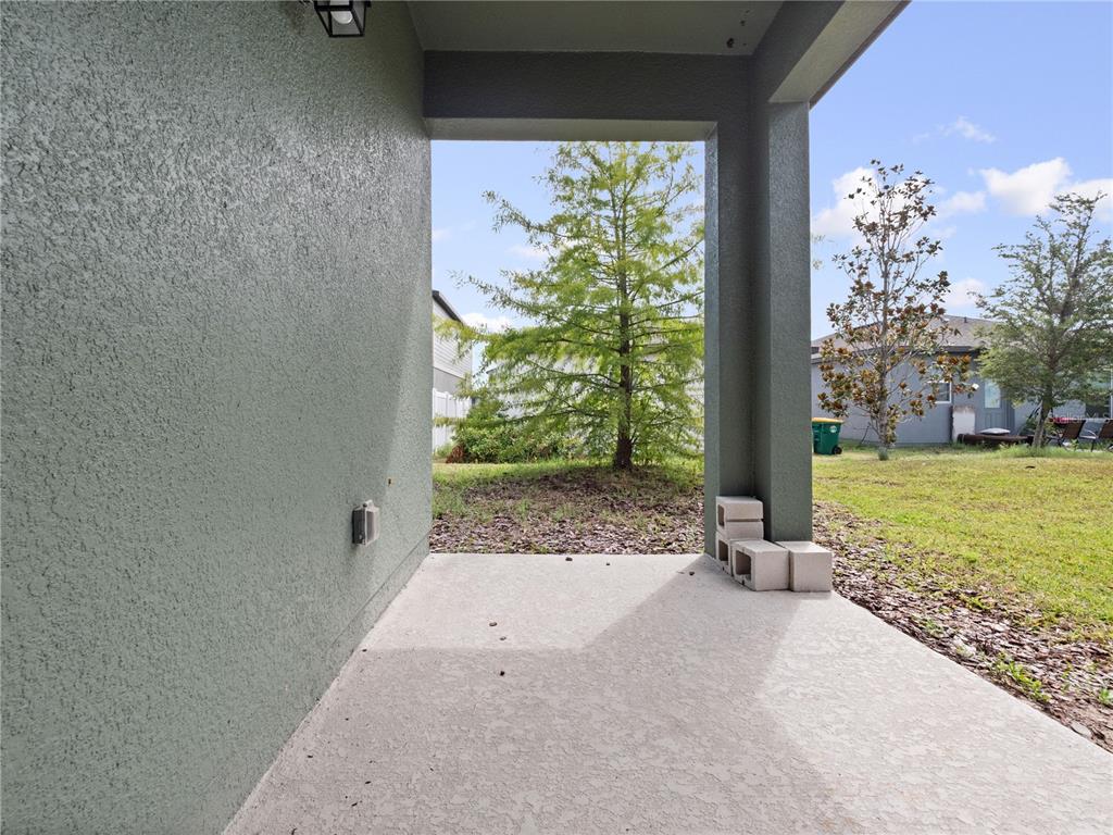 2249 Litchfield Loop DeLand, FL 32720 - Photo 24 of 27 a view of a yard with an outdoor space