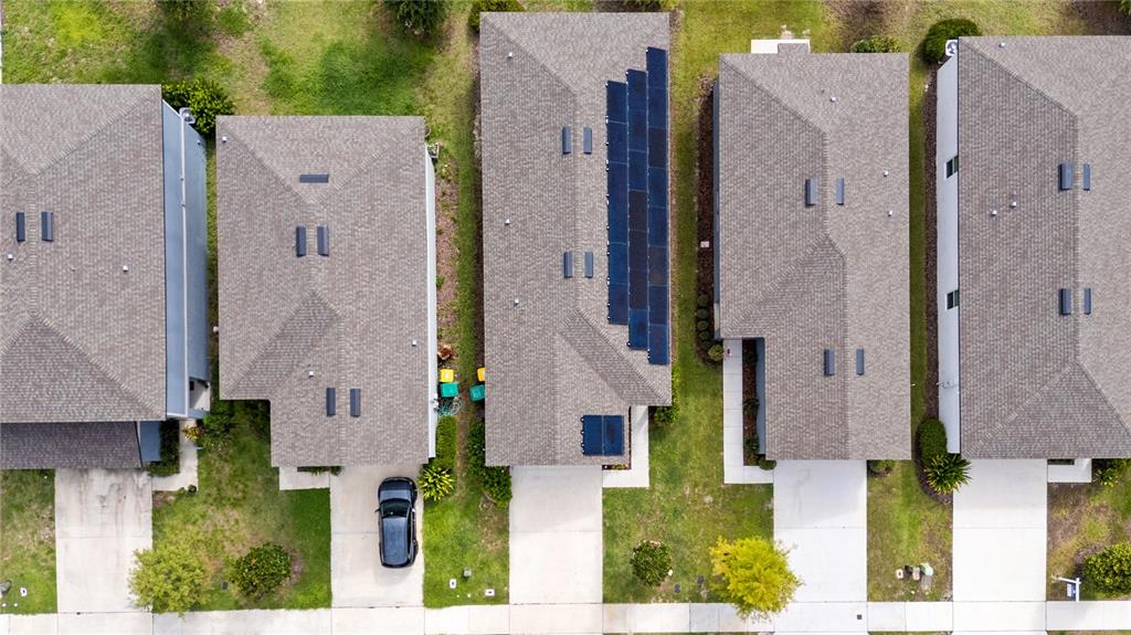 2249 Litchfield Loop DeLand, FL 32720 - Photo 26 of 27 an aerial view of a house with a yard and large tree
