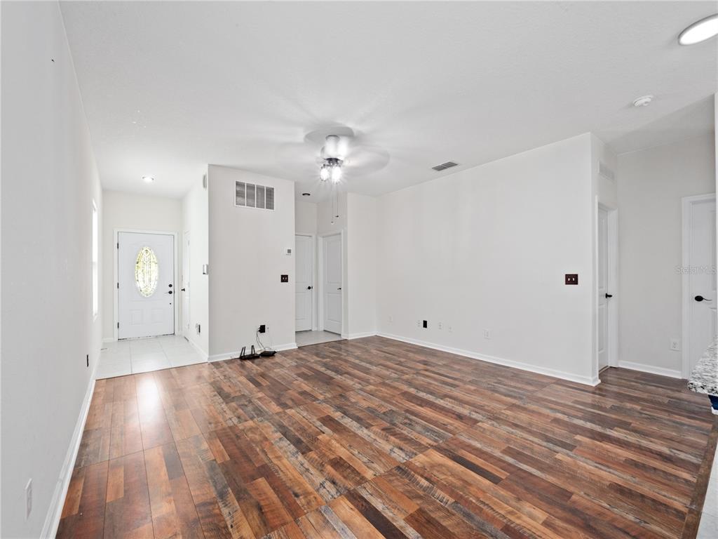 2249 Litchfield Loop DeLand, FL 32720 - Photo 7 of 27 a view of a livingroom with wooden floor