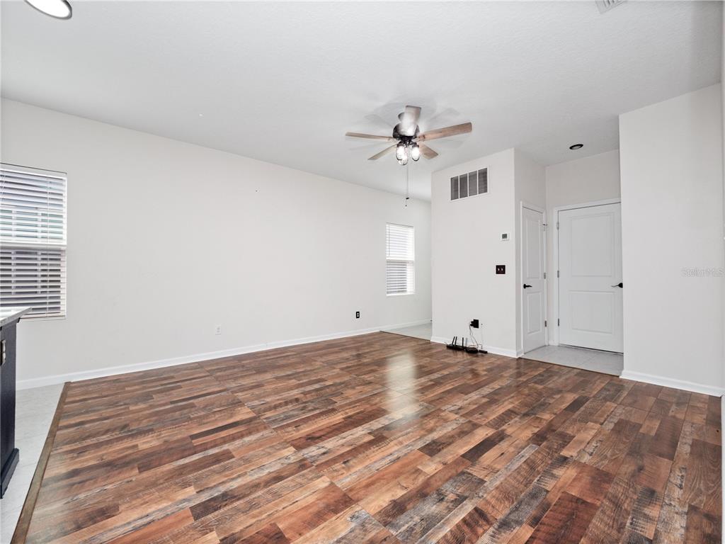2249 Litchfield Loop DeLand, FL 32720 - Photo 8 of 27 a view of an empty room with a chandelier fan
