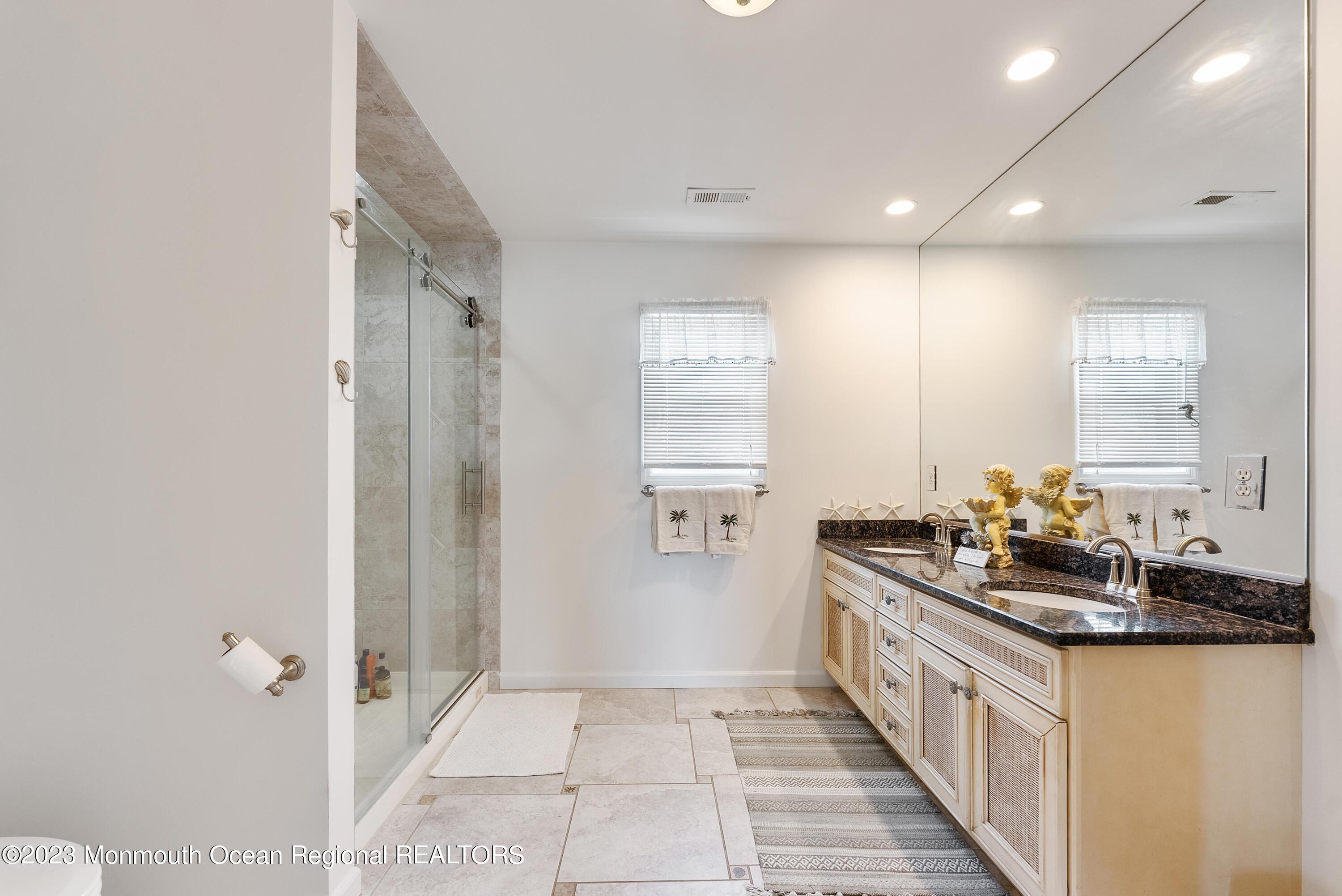 16 Brookfield Drive Brick, NJ 08723 - Photo 20 of 37 a bathroom with a double vanity sink and mirror