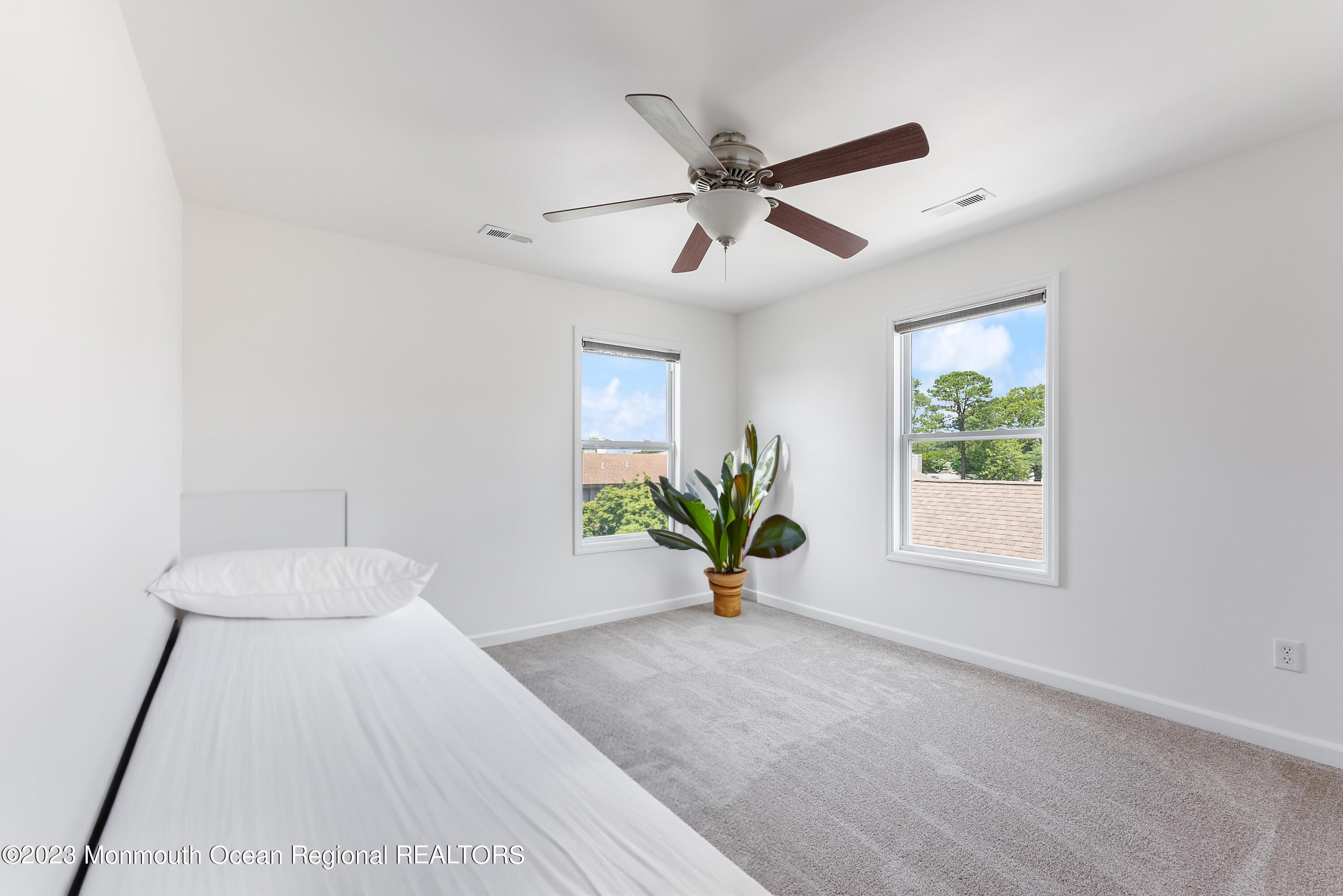 16 Brookfield Drive Brick, NJ 08723 - Photo 23 of 37 a view of an empty room and window