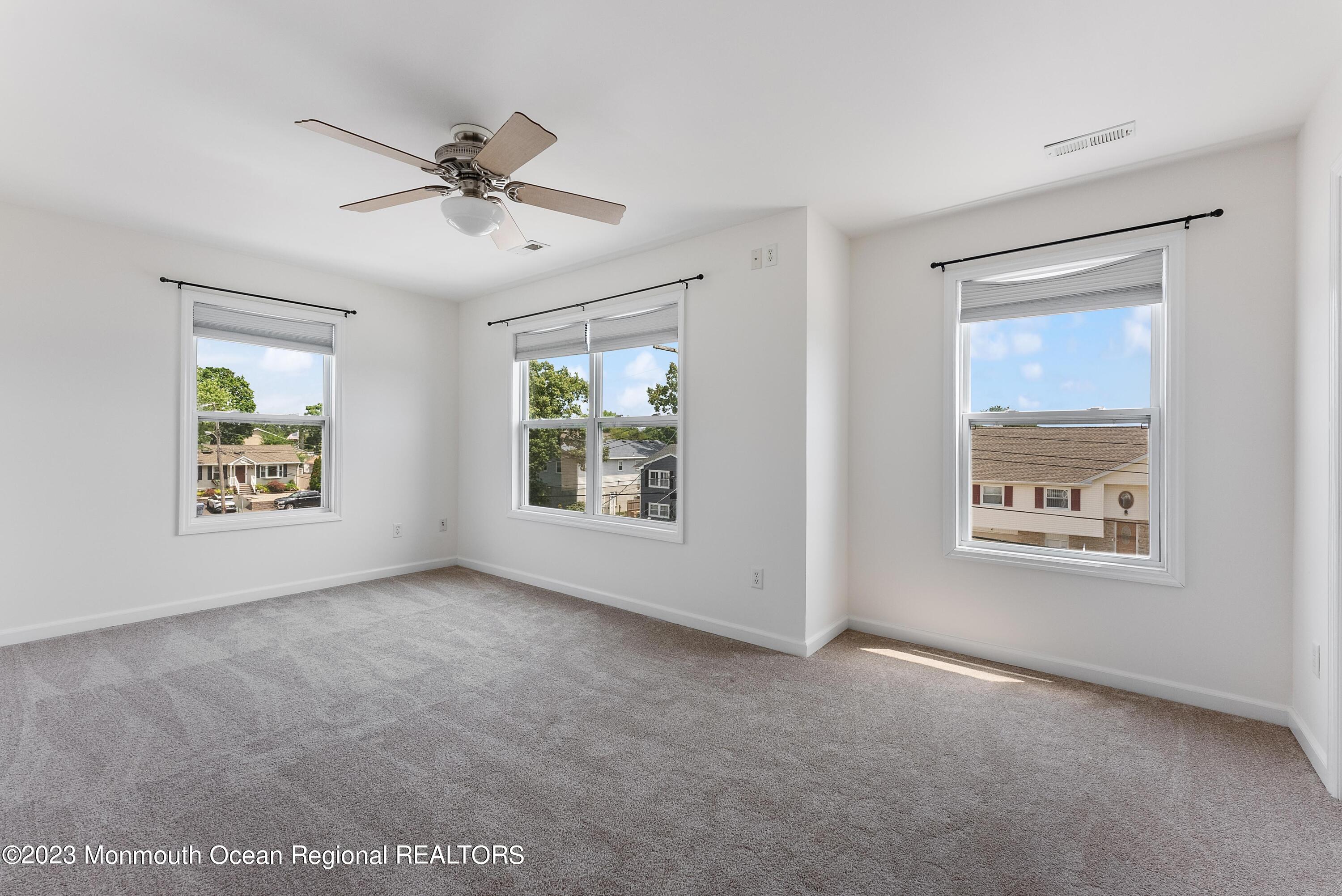 16 Brookfield Drive Brick, NJ 08723 - Photo 25 of 37 a view of an empty room with a window