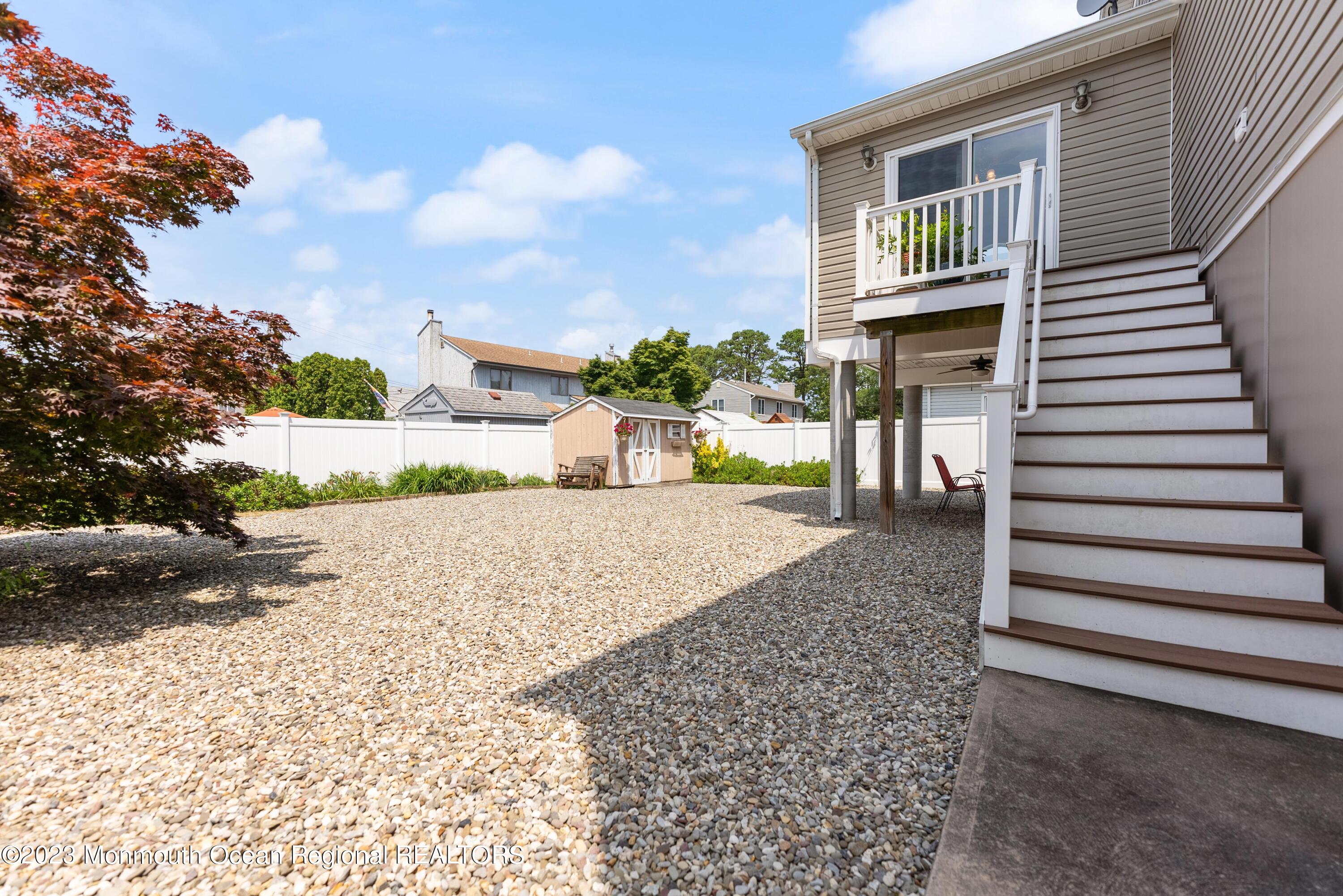 16 Brookfield Drive Brick, NJ 08723 - Photo 27 of 37 a view of a house with backyard and a slide