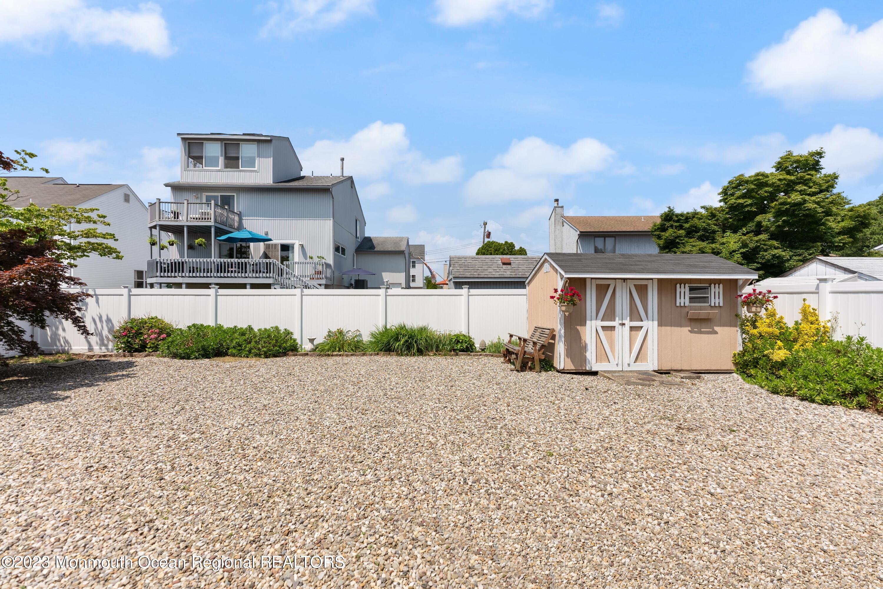 16 Brookfield Drive Brick, NJ 08723 - Photo 29 of 37 a front view of a house with a yard and garage