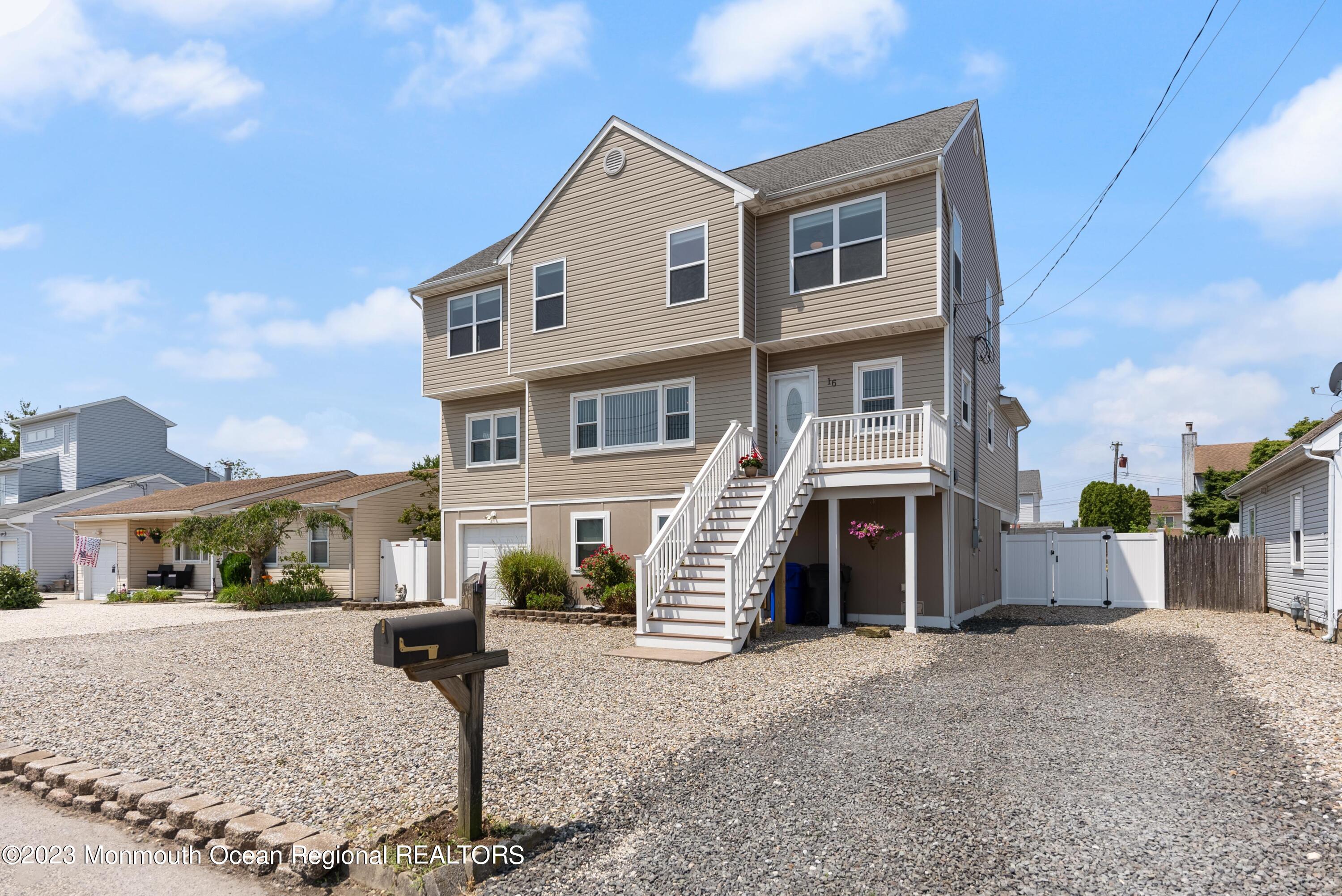 16 Brookfield Drive Brick, NJ 08723 - Photo 4 of 37 a front view of a house with a yard