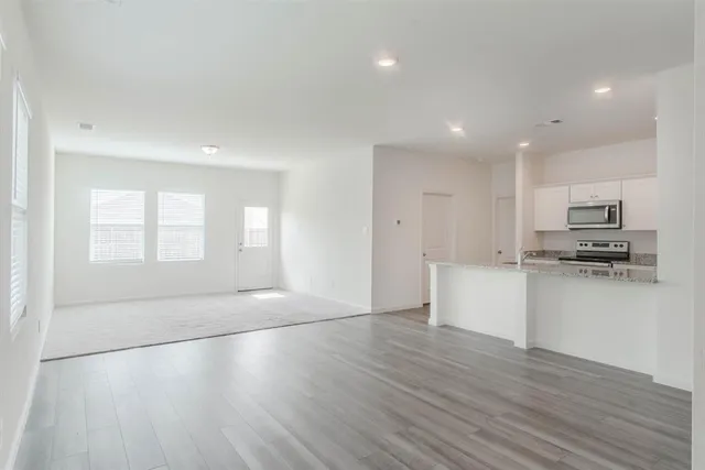 a view of kitchen with wooden floor