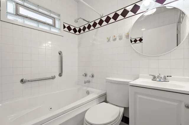 a bathroom with a sink a toilet and a bathtub