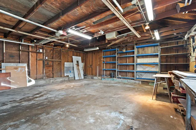 a view of an empty room with furniture